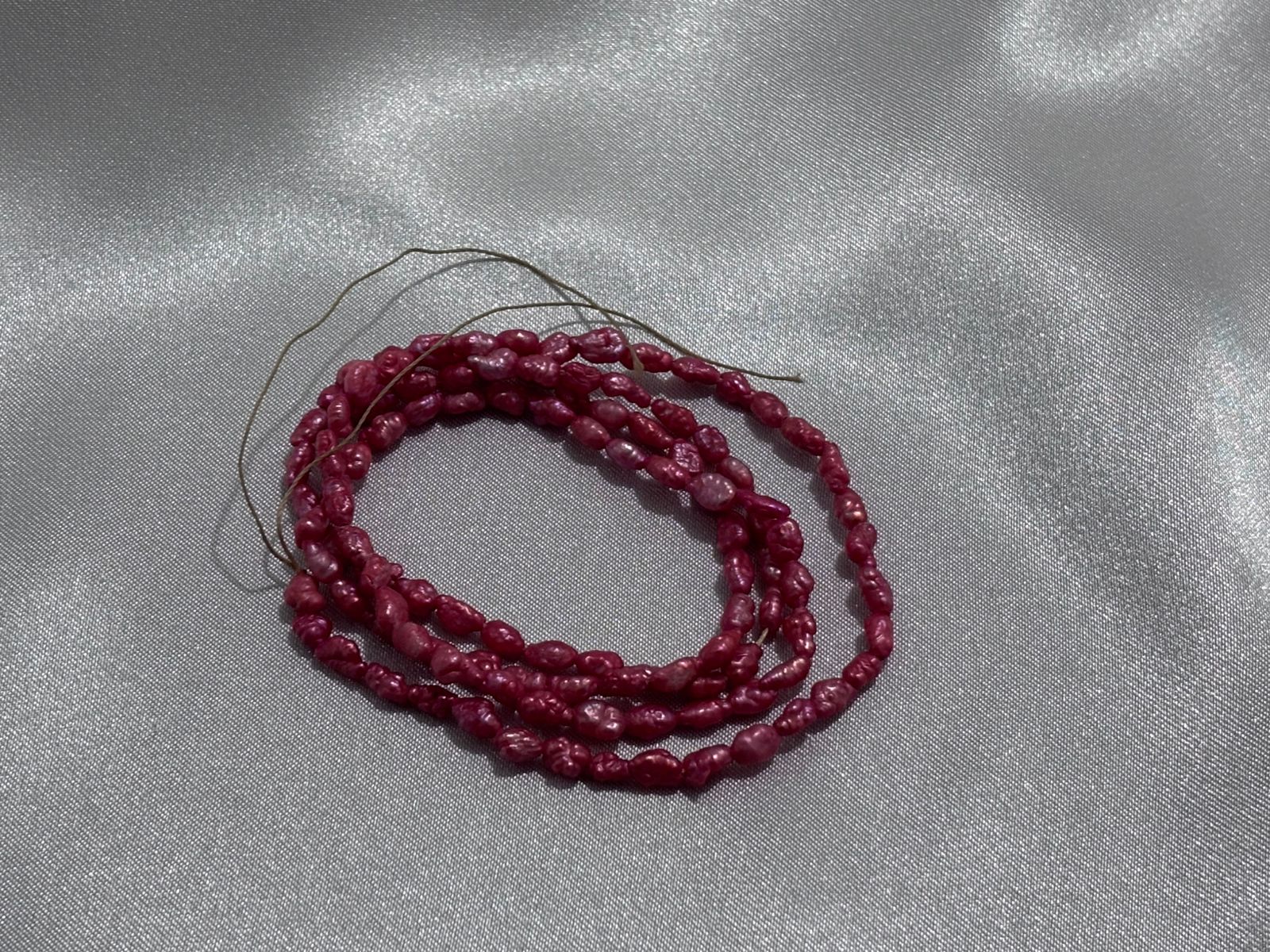Perla del río fucsia